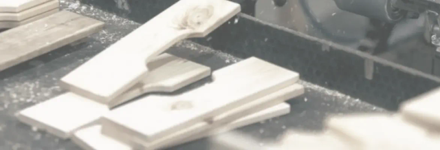 Close-up of foam pieces on a conveyor belt, likely in a manufacturing process.